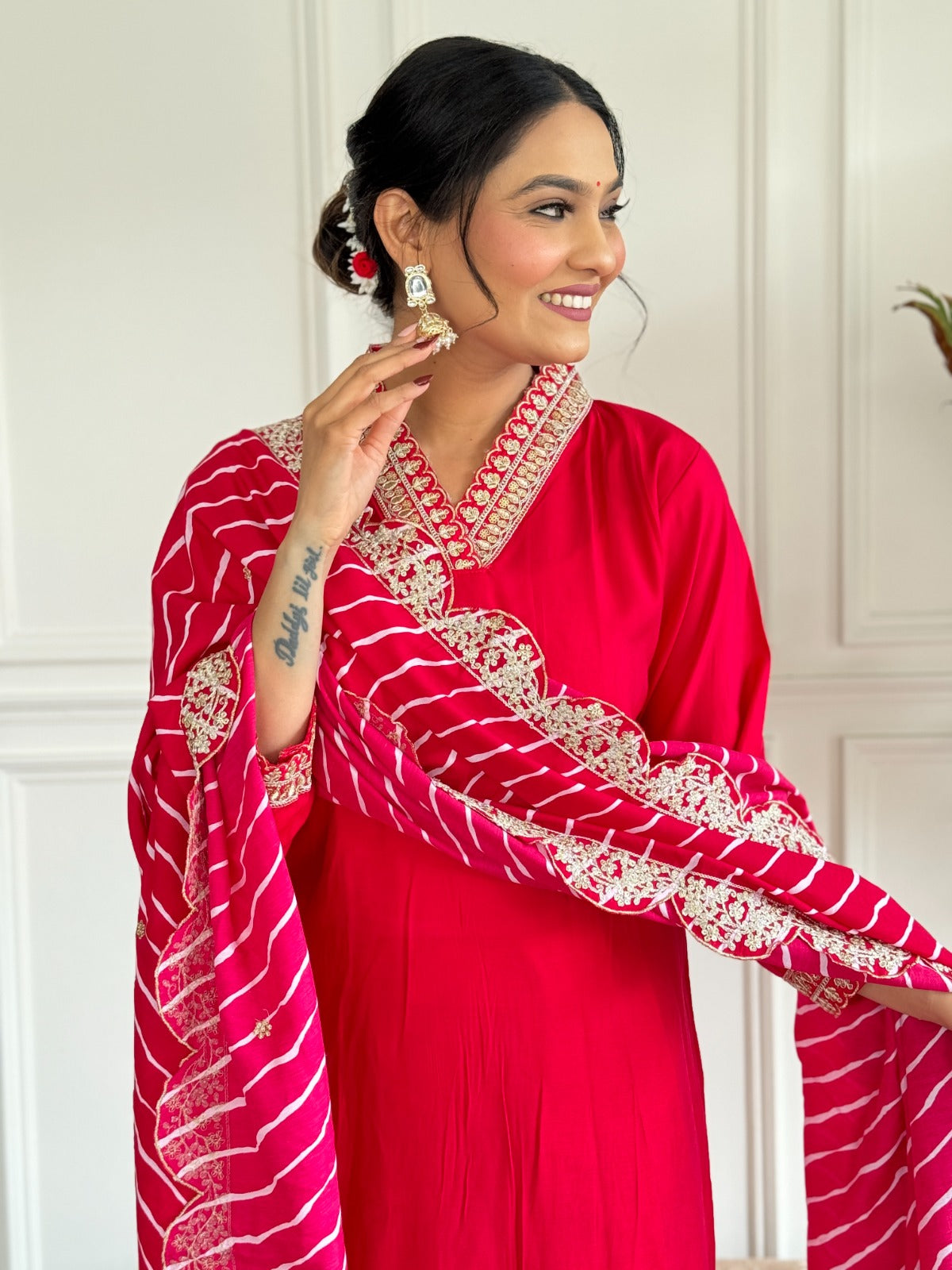 Festive red straight suit set featuring scalloped border bandhej dupatta