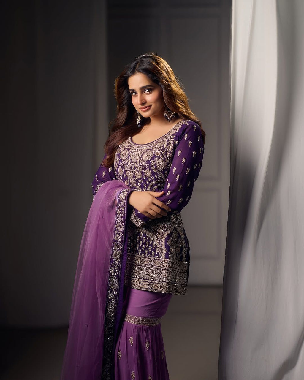 Royal purple embroidered sharara suit with net dupatta