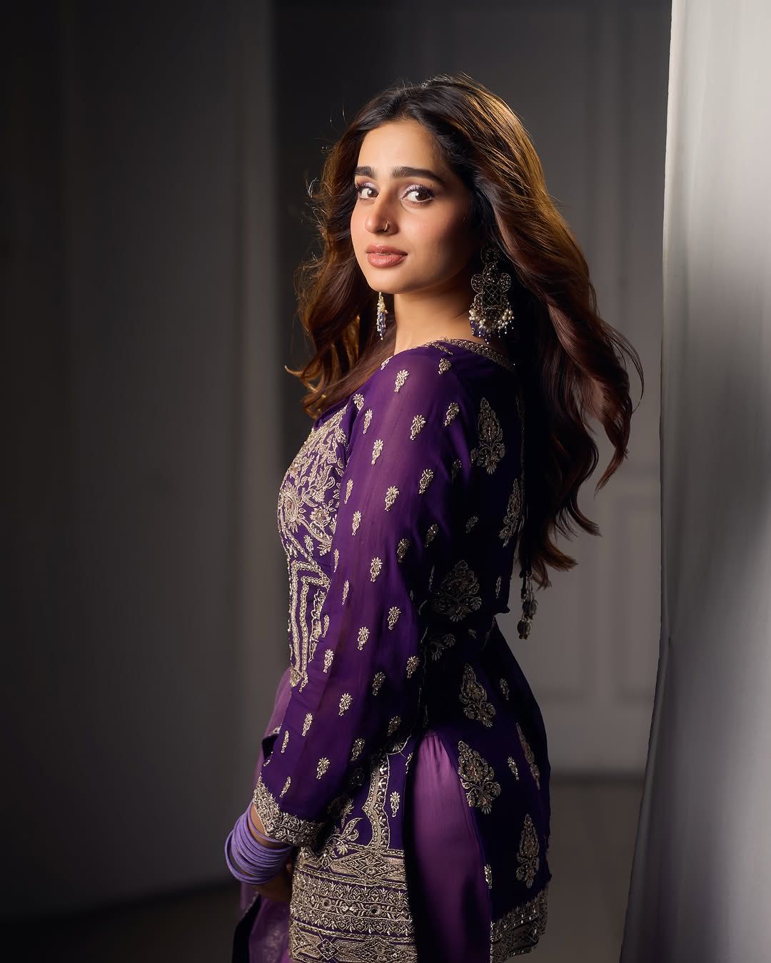 Royal purple embroidered sharara suit with net dupatta