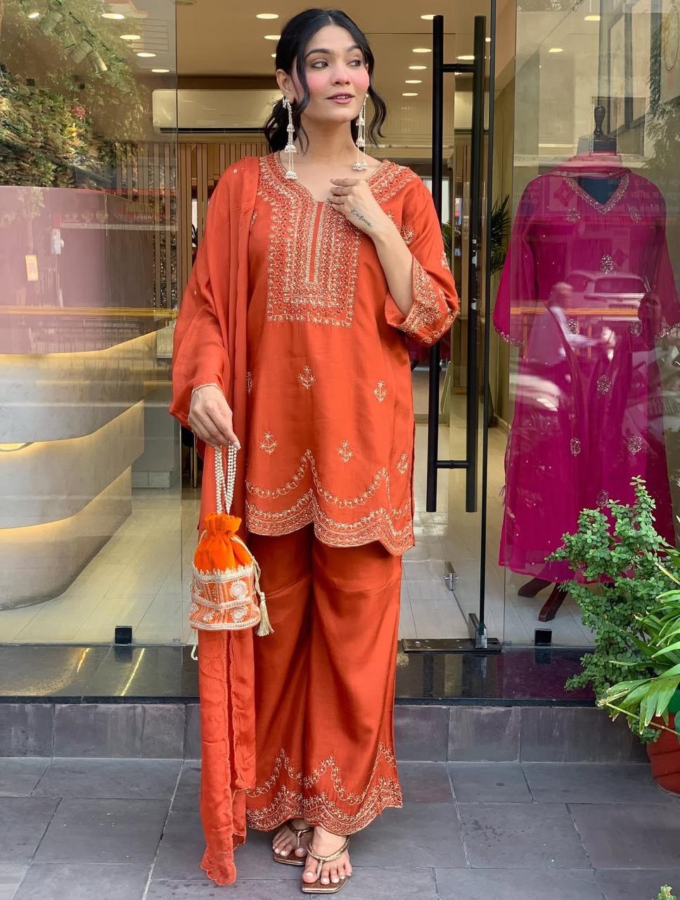 Rust Orange Embroidered Three-Piece Suit with Dupatta & Potli Bag