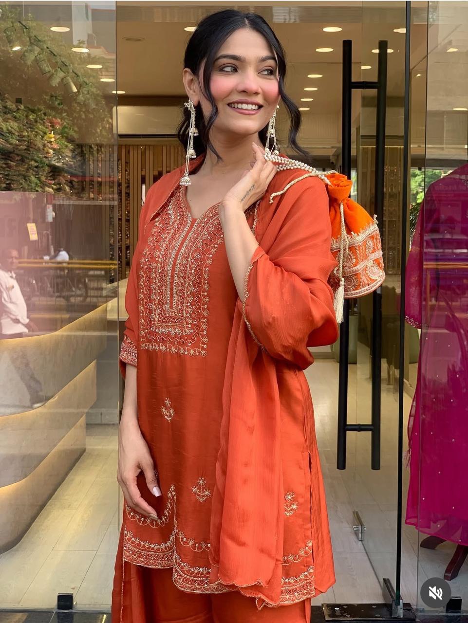 Rust Orange Embroidered Three-Piece Suit with Dupatta & Potli Bag